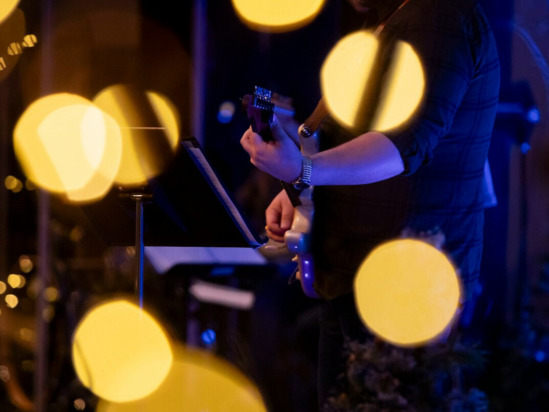 Videographer recording ambiance sounds at a live event